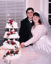Paul and Sarah cut the cake